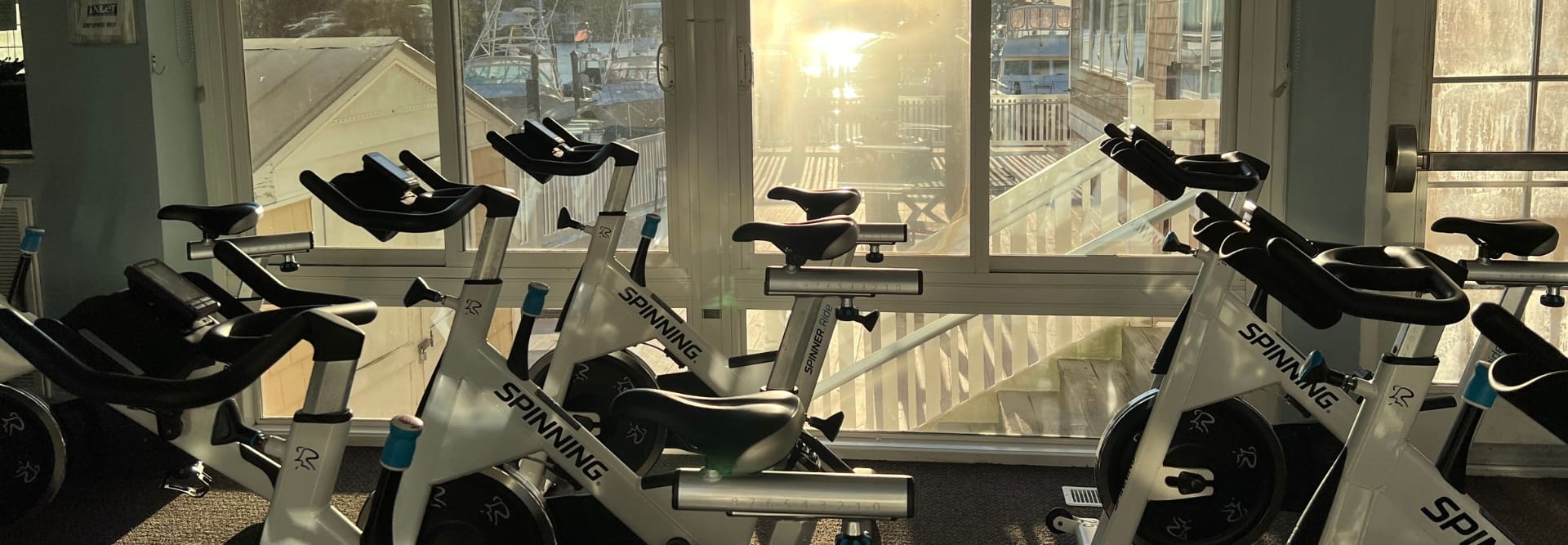 stationary bikes in a row in a spin studio at inlet fitness in virginia beach