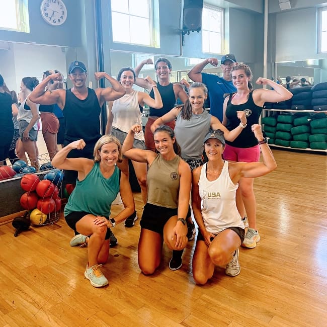 gym members pose for a group photo after a group exercise class at inlet fitness