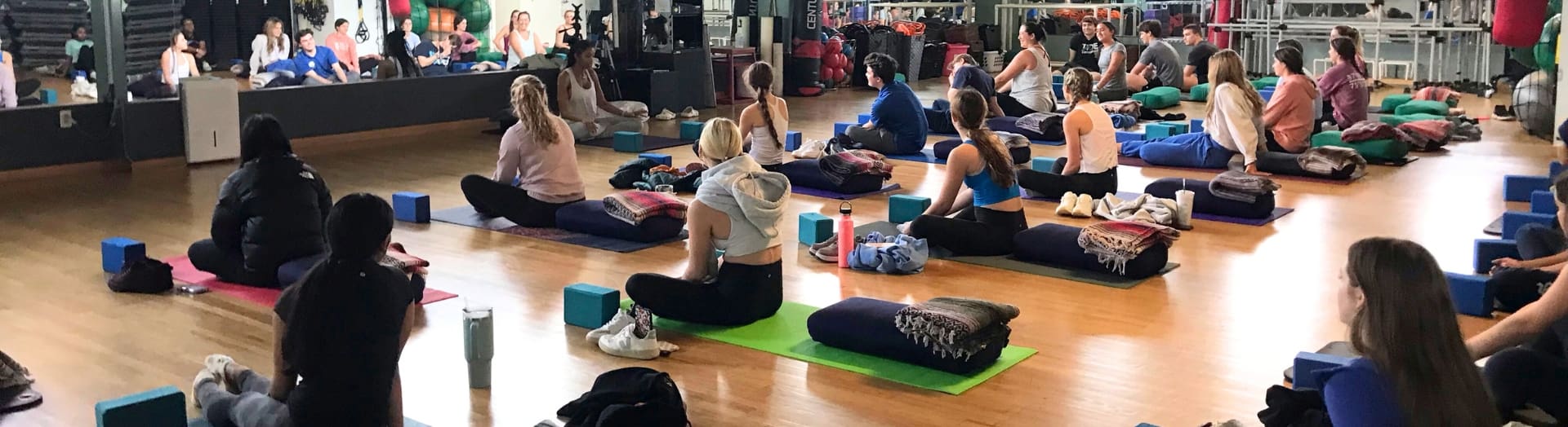 gym members sit during a yoga class at inlet fitness in virginia beach