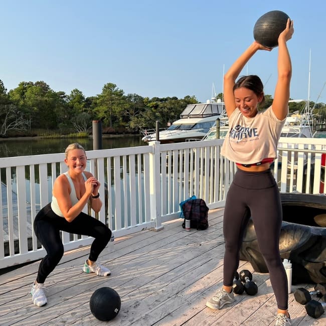 gym members do a HIIT workout on the back deck at inlet fitness in virginia beach