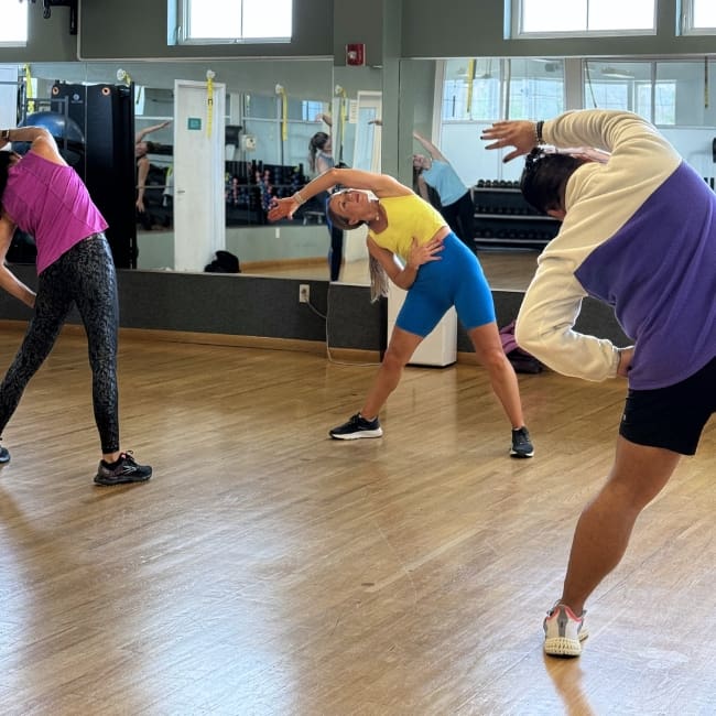 gym members stretch during a group fitness class at inlet fitness in virginia beach