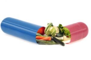 colorful capsules with fruits and veggies spilling out